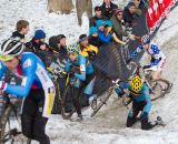 The Belgian rider goes down and Logan Owen chases at the Elite World Championships of Cyclocross 2013. © Brian Nelson