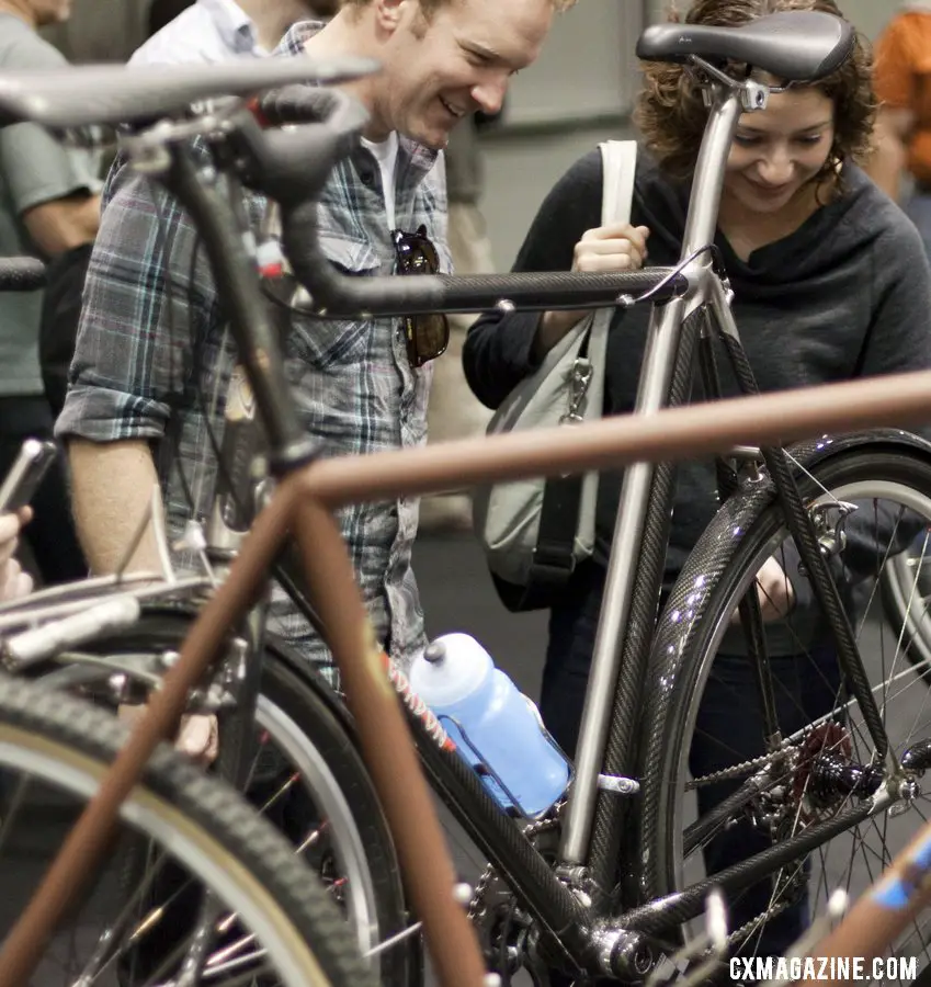 Attendees check out Bruce Gordon\'s favorite personal bike, his carbon and titanium 650b mixed terrain bike. ©Cyclocross Magazine