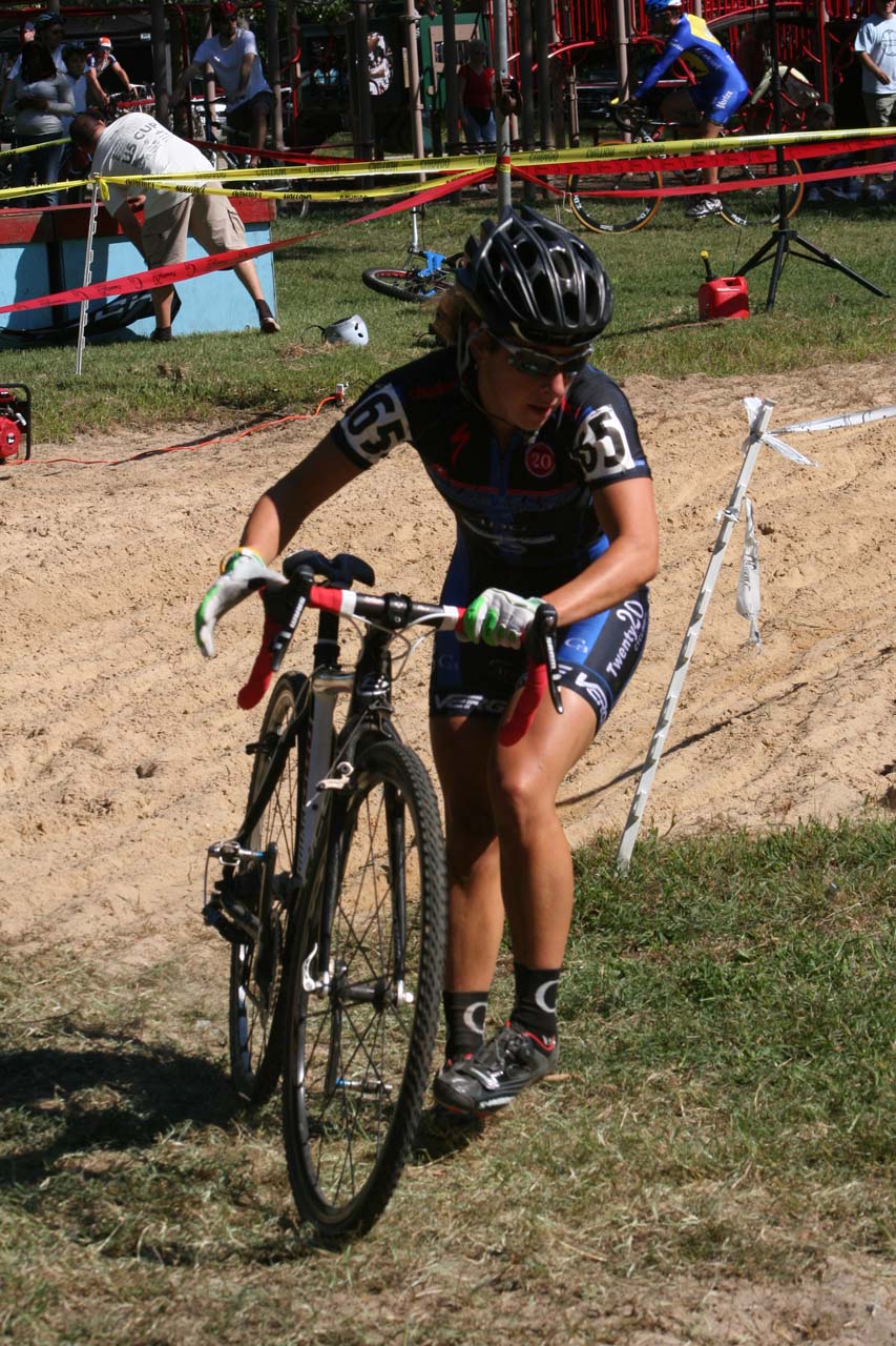 Kemmerer readies to shoulder her bike for the second sand pit. © Jamie Mack