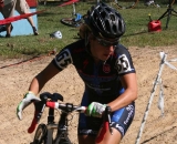 Kemmerer readies to shoulder her bike for the second sand pit. © Jamie Mack