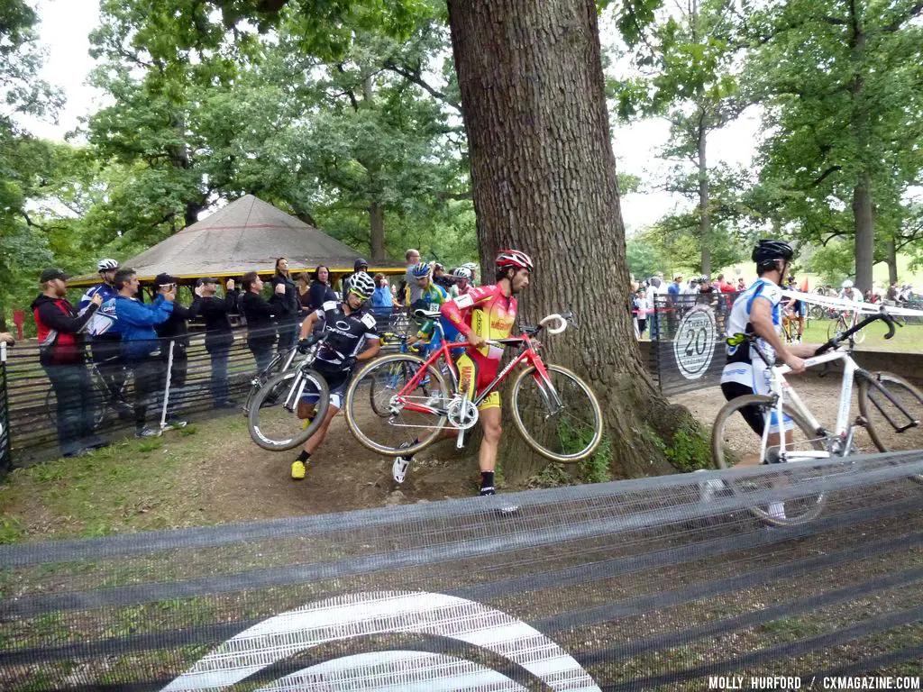 Field comes around the tree.   © Cyclocross Magazine