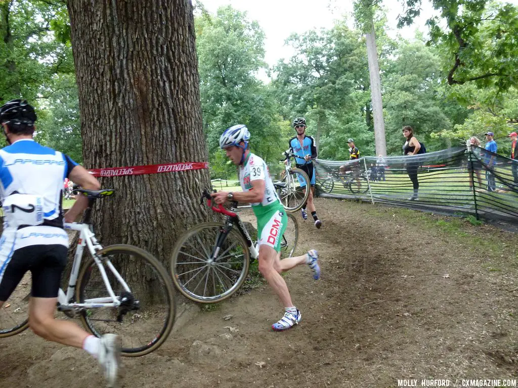 Livermon keeps his bike in the air around the barrier. © Cyclocross Magazine