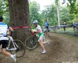 Livermon keeps his bike in the air around the barrier. © Cyclocross Magazine