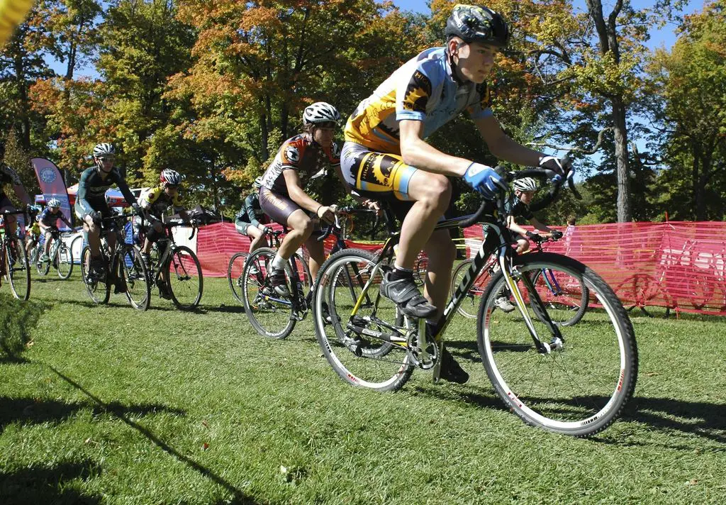 Junior riders roll down the straightaway at the Chicago Cross Cup at Hopkins Park in Dekalb Illinois.  ©  Aaron Johnson