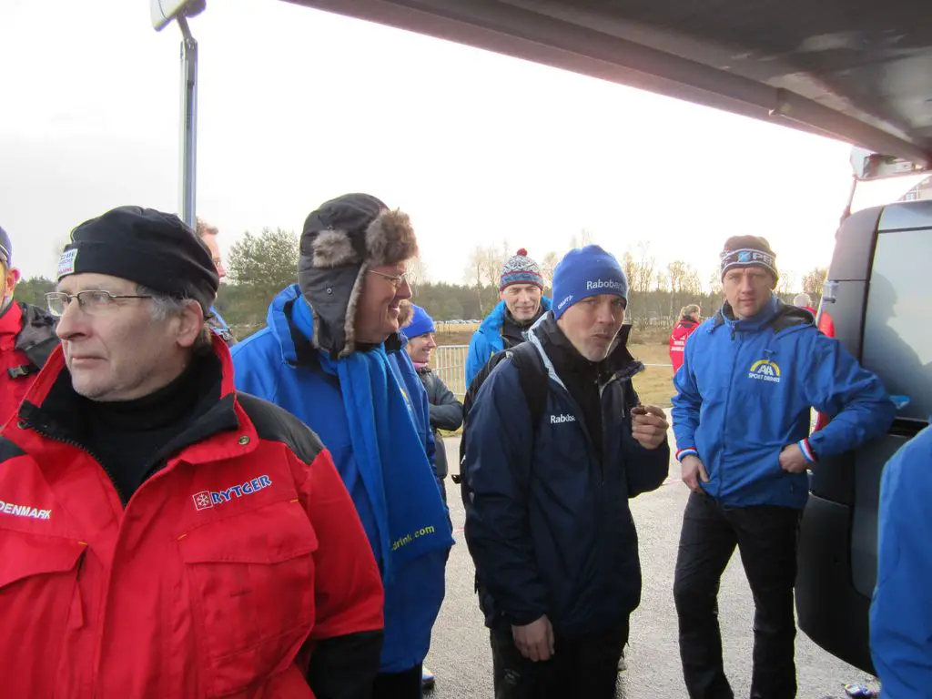  Peter Meere eating a cookie is a helper of Vardaros when not busy with Lars van der Haar - and standing against car is Van den Brand\'s husband Johan © Christine Vardaros