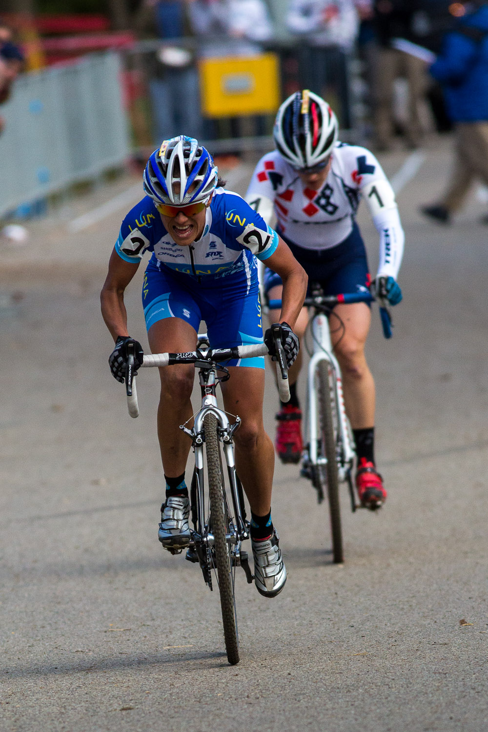 Katerina Nash, foreground, and Katie Compton sprinting towards the finish. © Kent Baumgardt