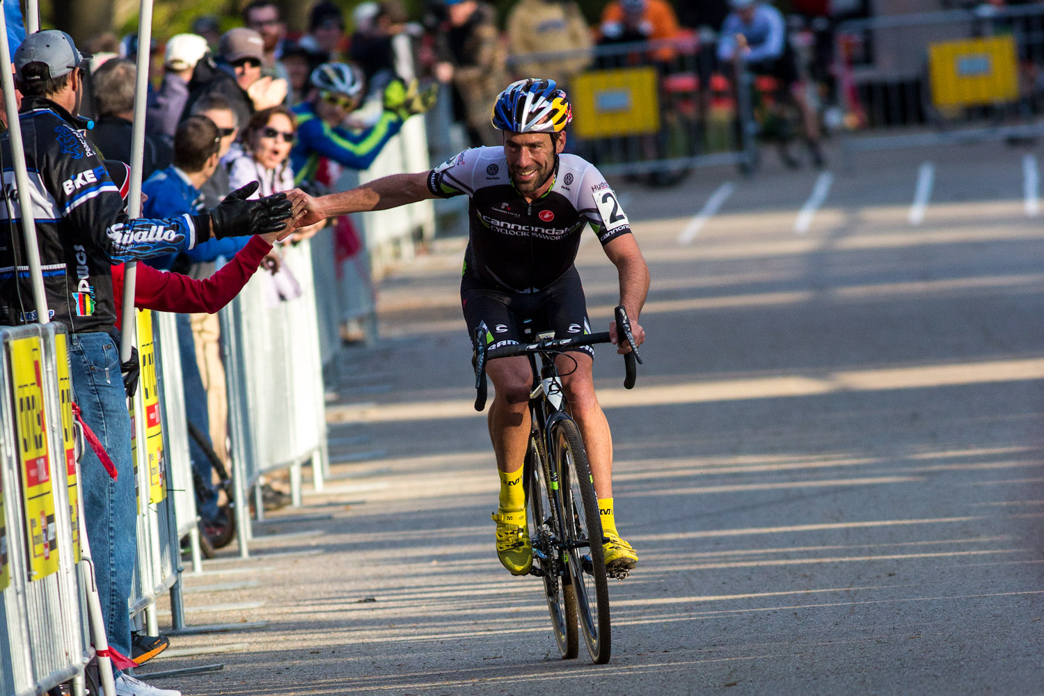 Tim Johnson high-five’s fans on the way to the win. © Kent Baumgardt