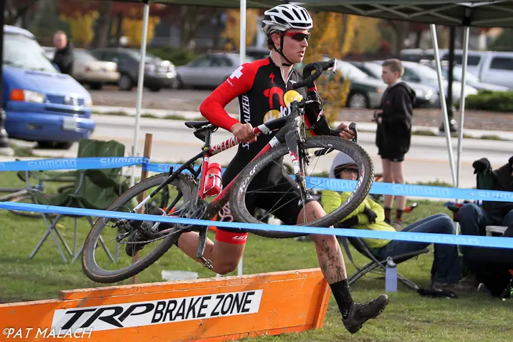 Junior Sam Rosenberg takes the barriers in the Men\'s A race. © Pat Malach