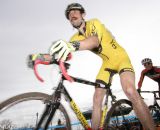 A rider navigates one of the muddy corners. © Pat Malach