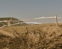 Courtney Gregory battles the winds across the Pump Track. by Karen Jarchow