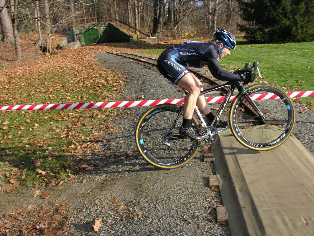 Laura Van Gilder jumps over the train tracks. ? Paul Weiss