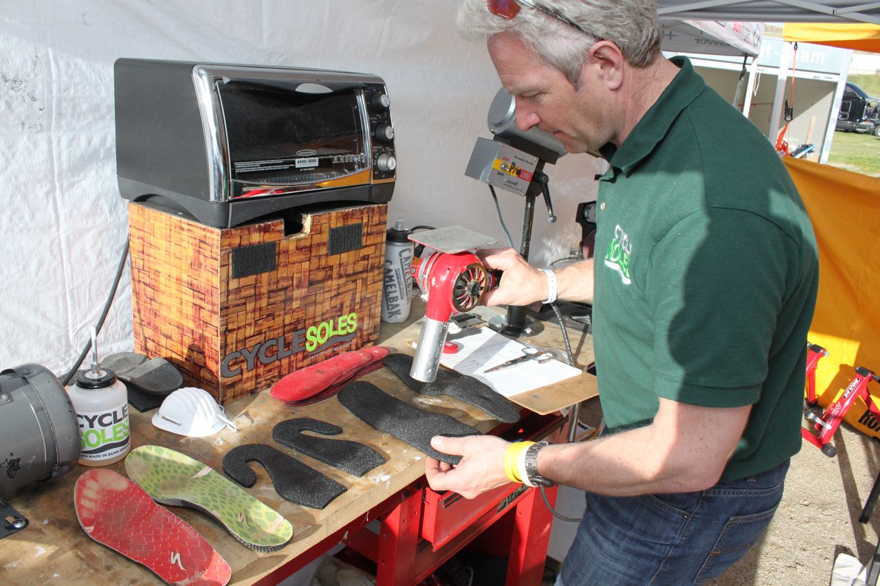 Scott applies glue to the two pieces and uses a hair dryer to sp