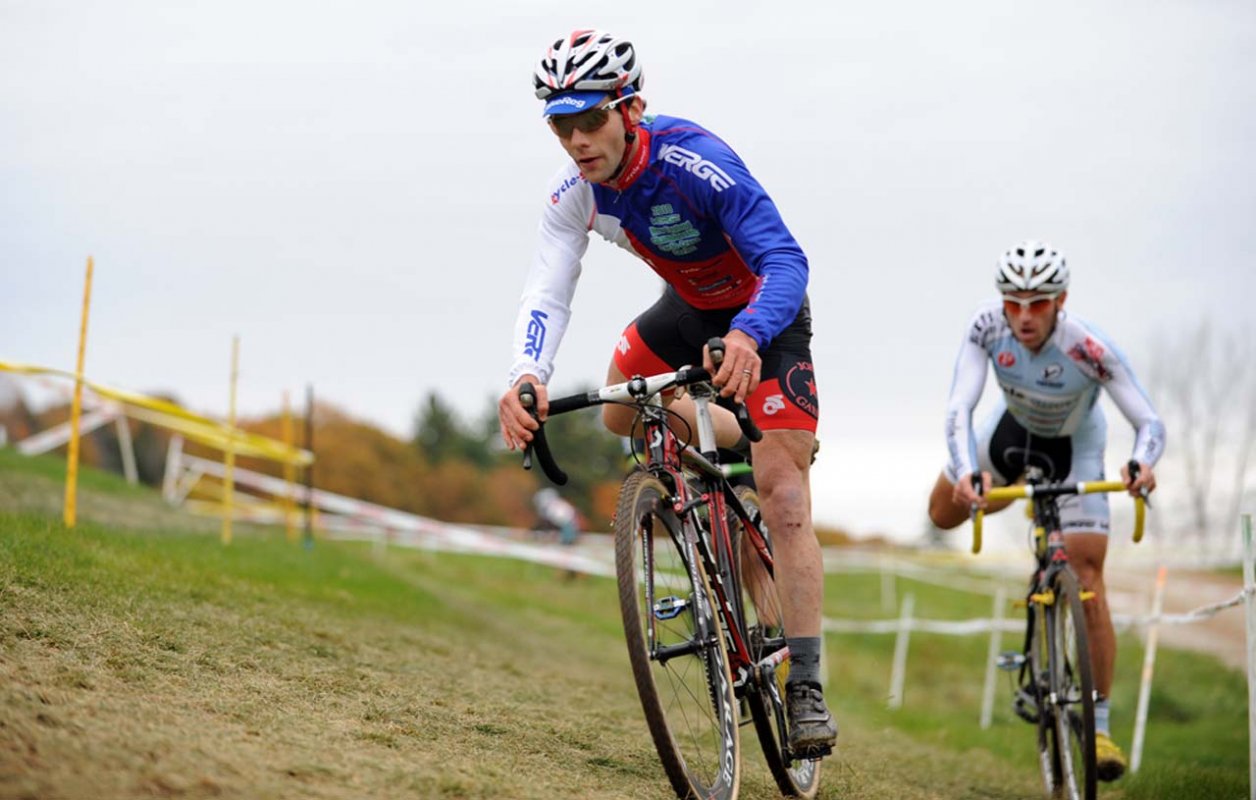 Justin Lindine (bikereg.com/Joe’s Garage/Scott) leads Adam Myerson (Cycle-Smart) into the barriers © Natalia Boltukhova | Pedal Power Photography