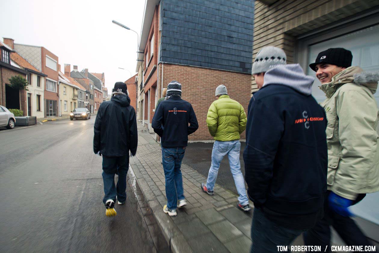 The crew heads into town for a well deserved treat of pizza and pastries after time on the bike. © Tom Robertson