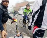 Todd Anderson, head mechanic for the Euro Cross Camp, helping the racers get their bikes dialed for the training race. © Tom Robertson