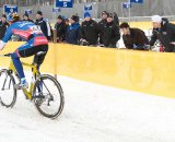 Danny Summerhill riding by the pit with Geoff Proctor offering encouragement