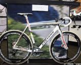Stevens is displaying a an interesting prototype: white carbon fiber beauty features disc brakes and integrated seat mast & internal cable routing. Though there is no battery present, the bike definitely features Di2 Dura Ace shifters. © Jeff Lockwood