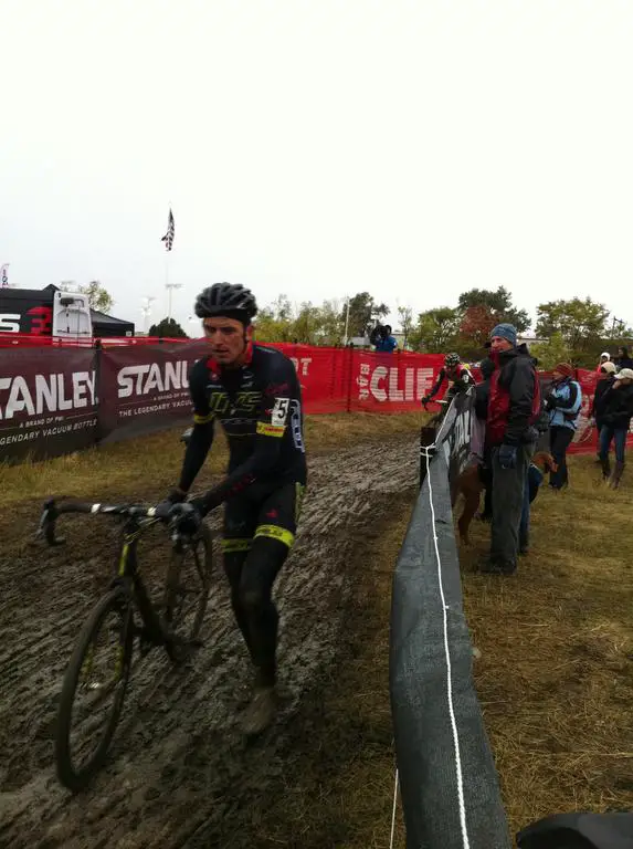 Trebon dismounts and runs ahead of a barrier. © Grant Berry