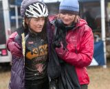 One very cold and muddy rider huddles for warmth. © Wil Matthews 