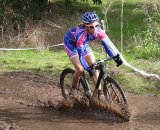 Karen Brems rushes the mud pit. © Paul Guerra