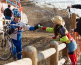 Taking handups in the men's 50-54 race at 2014 USA Cyclocross National Championships. © Mike Albright