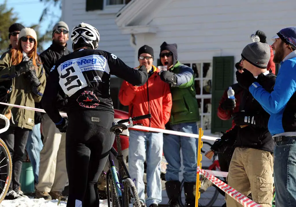 The beer hand-up is a honored tradition among the Ice Weasels. ? Natalia McKittrick | Pedal Power Photography | 2009