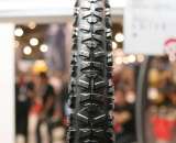 Hutchinson has a Crosstown tire, designed for commuters and cyclocross training. This Pirannha-like treaded tires is 650 grams at 32c.