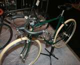 This green model was built commuter-style with mustache bars and fat road tires. ?Cyclocross Magazine