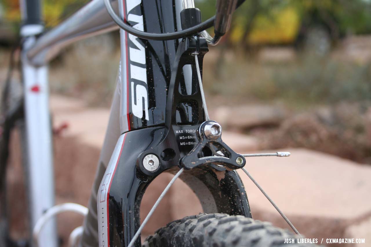 The CNC\'ed cable hanger is integrated into the all carbon fork. © Cyclocross Magazine