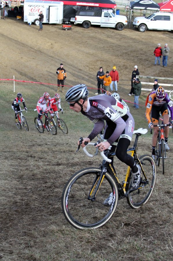 Tristan Schouten got the holeshot, led through the field, the barriers, and was the first one up the first hill section. Jingle Cross 2010 Day 3. © Amy Dykema