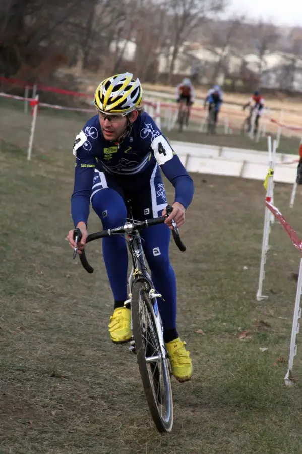 Mike Sherer eyes the hill after coming through the barriers. Jingle Cross 2010 Day 3. © Amy Dykema