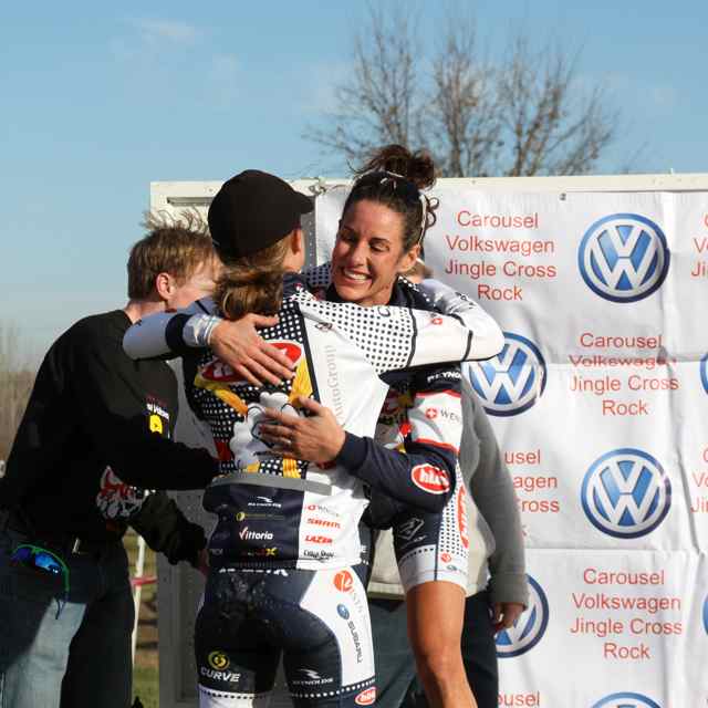 Teammates Duke and Miller hugging on the podium © Amy Dykema