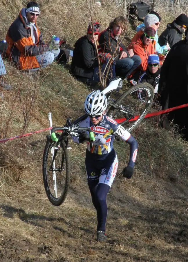 Amanda Miller running the bike up Mt. Krumpet in first place early in the race.  © Amy Dykema