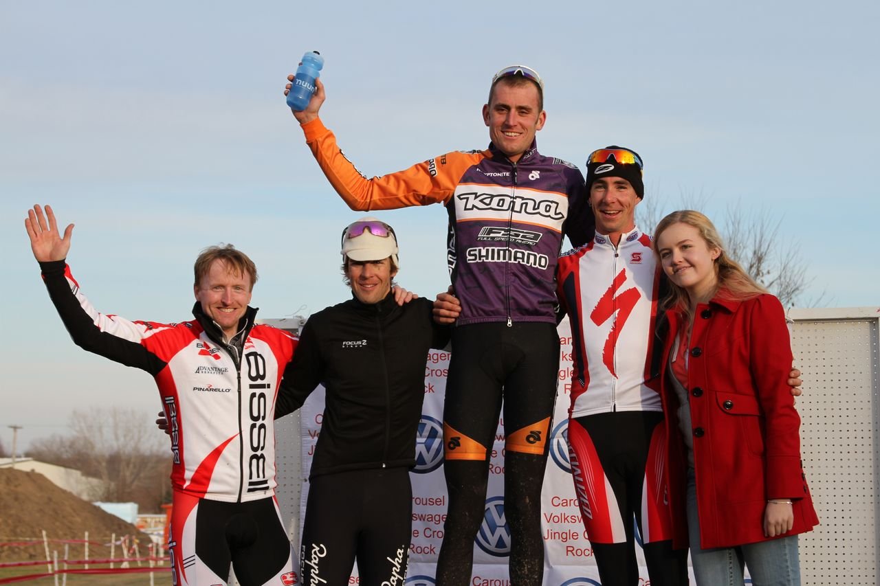 Race Director John Meehan with the top three elite men.© Amy Dykema