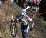 Amanda Miller running the bike up Mt. Krumpet in first place early in the race.  © Amy Dykema