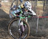 Kaitie Antonneau shouldering the bike up the hill. © Amy Dykema