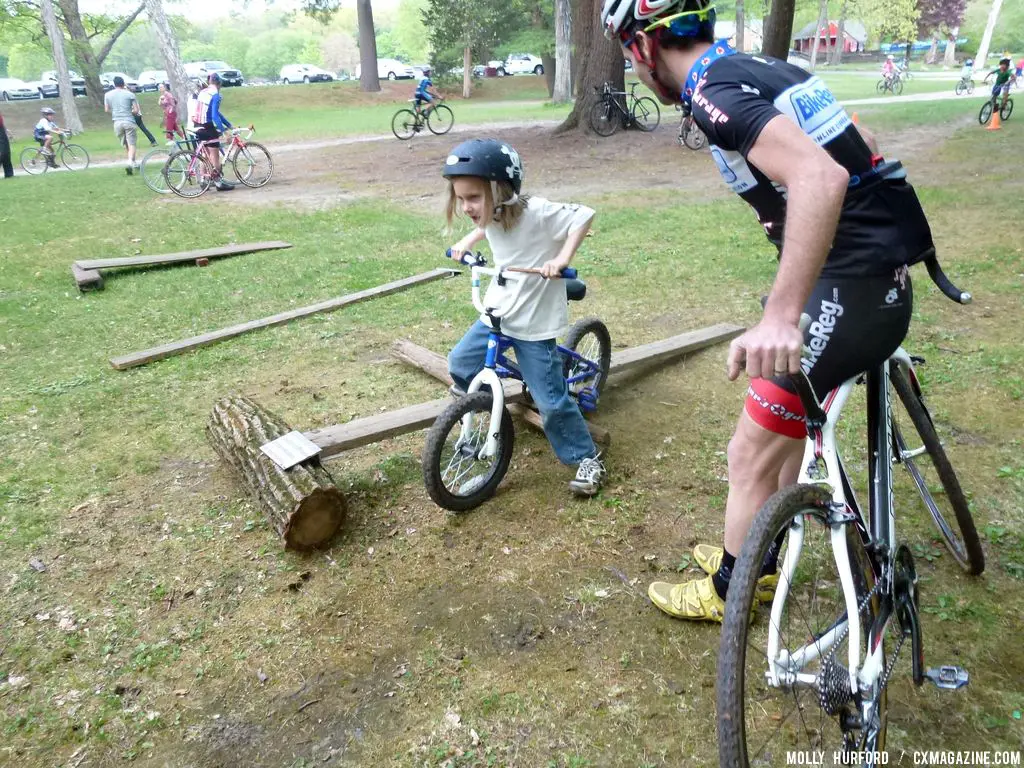 Practicing riding in a straight line, over a board and log setup © Cyclocross Magazine