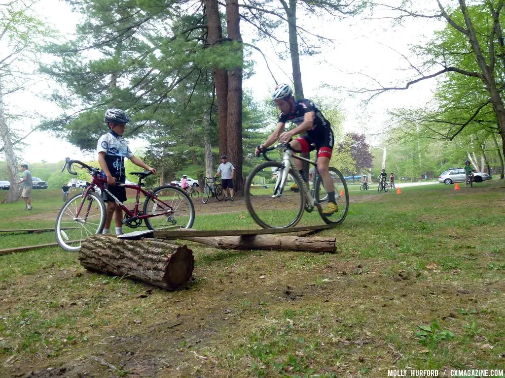 Practicing riding in a straight line, over a board and log setup © Cyclocross Magazine