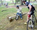 Practicing riding in a straight line, over a board and log setup © Cyclocross Magazine