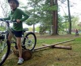 Practicing riding in a straight line, over a board and log setup © Cyclocross Magazine