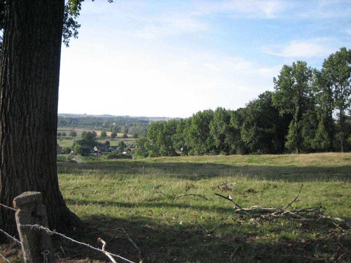 The untainted field. It\'s hard to tell there have been many battles fought on this grassy spot. We are looking at the top of the descent.  by Christine Vardaros  