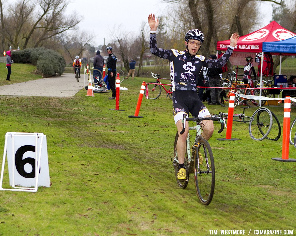 Josh Snead (HRS/Bay 101/Rocklobster) raises his arm in celebration of his race win.