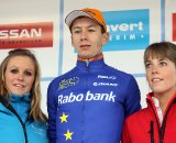 GvA overall leader Lars van der Haar flanked by podium girls Sarah van der Elst (L) and Lien Lauwers (R).