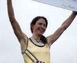 Simms on the podium sporting her trophy © Matthew J. Clark/www.strfilms.com 