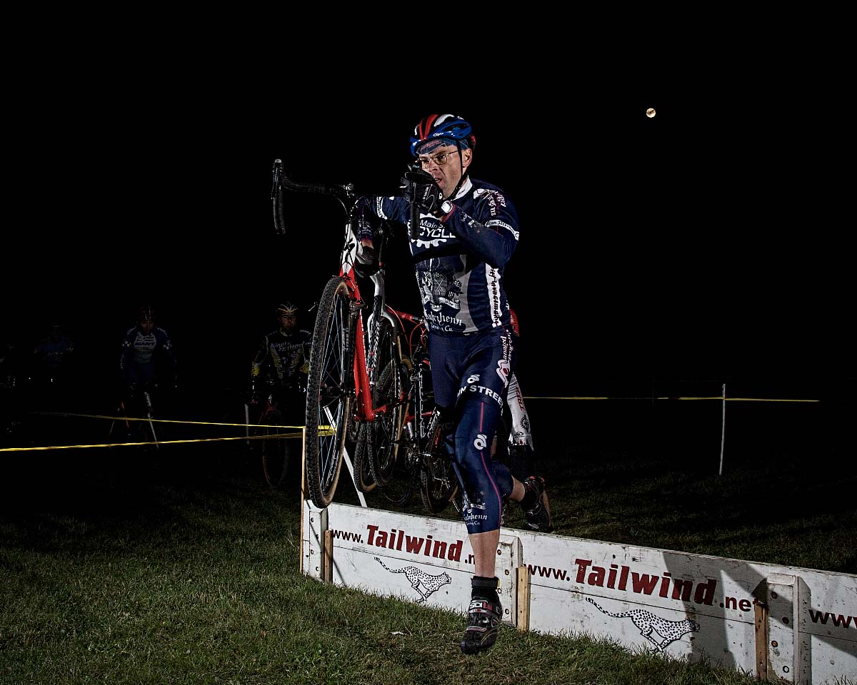 Rob Selle/Main Street Bicycles jumps the barriers under the moon. ? Andrea Tucker 2009/www.tuckerbikes.com 