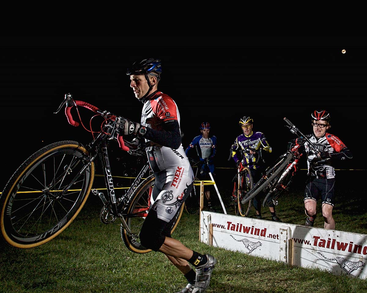 Master Racers navigate the the barriers under the moon in the Munson Park Night-Cross. ? Andrea Tucker 2009/www.tuckerbikes.com 