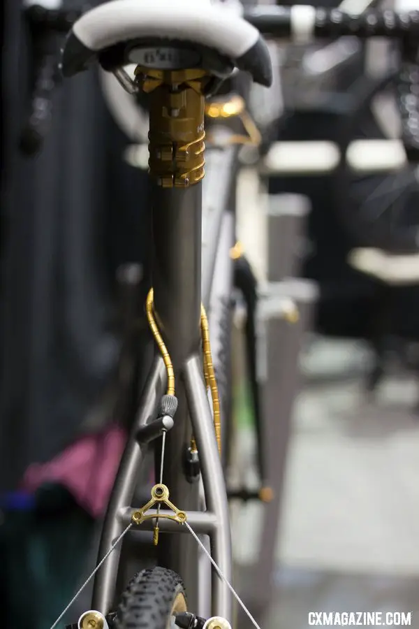 A built-in rear cable hanger, similar to that on a Moots, plus gold accents on cable housing, seatstays and brakes add a touch of class on the Mosaic Cyclocross bikes at Nahbs 2012. ©Cyclocross Magazine