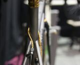 A built-in rear cable hanger, similar to that on a Moots, plus gold accents on cable housing, seatstays and brakes add a touch of class on the Mosaic Cyclocross bikes at Nahbs 2012. ©Cyclocross Magazine