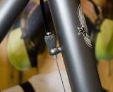 The front derailleur cable stays tight to the seat tube, and is adjustable via a built-in barrel adjuster on the housing stop. ©Kevin White