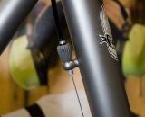 The front derailleur cable stays tight to the seat tube, and is adjustable via a built-in barrel adjuster on the housing stop. ©Kevin White The front derailleur cable stays tight to the seat tube, and is adjustable via a built-in barrel adjuster on the housing stop. ©Kevin White